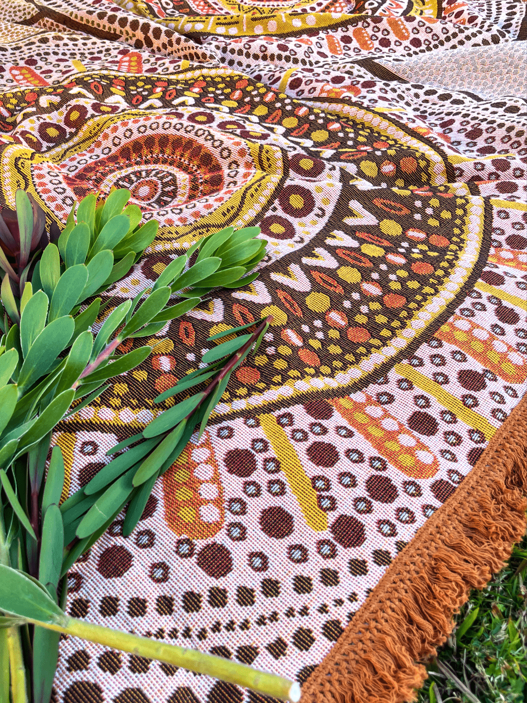 Close up of Stomping Ground throw design details. Indigenous Aboriginal art picnic blanket